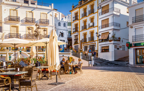People enjoying the summer at Central Plaza at city Competa, Andalusia, Spain