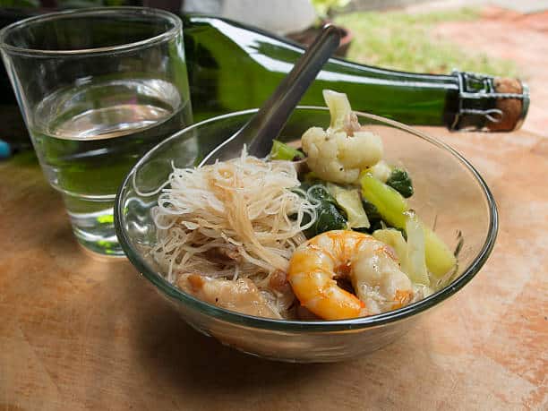 Home made fried rice noodles topped with pork,Thai food